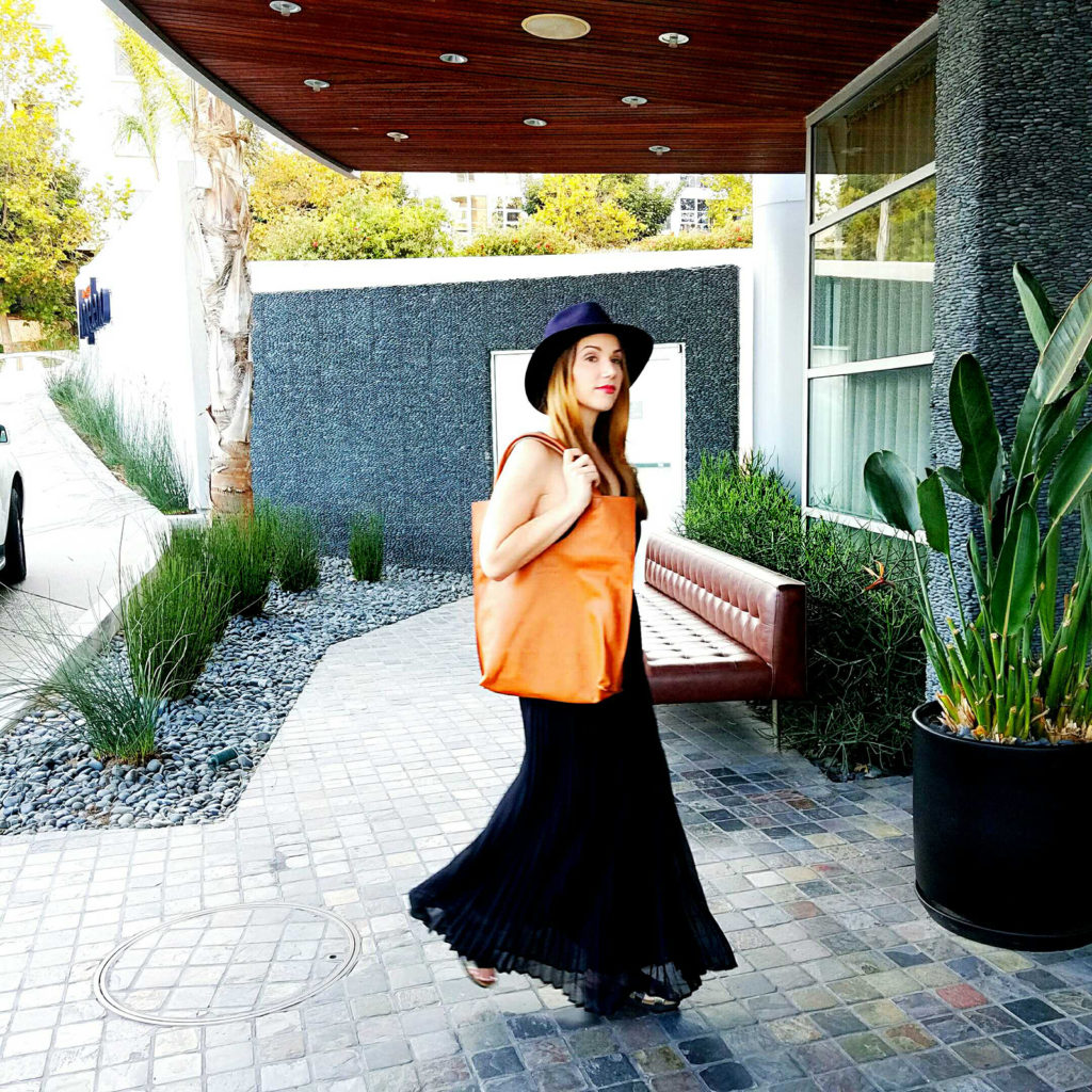 girl walking into hotel